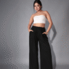 Model wearing bandeau top and wide-leg pants set in white and black