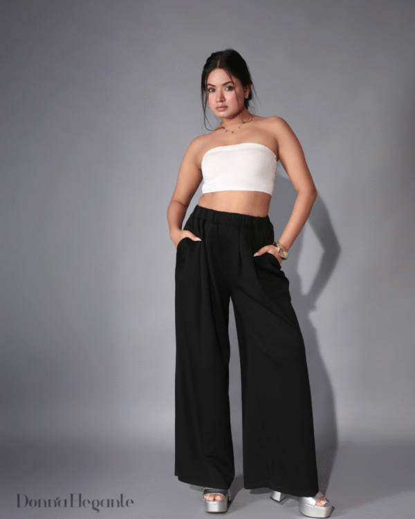 Model wearing bandeau top and wide-leg pants set in white and black
