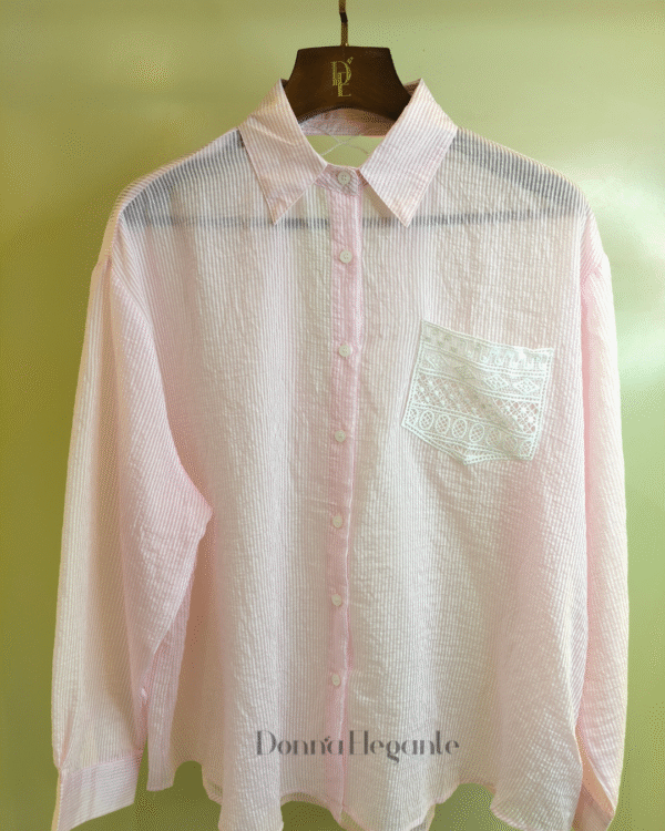 Pink shirt with a lace back design and embroidered front pocket, a stylish and comfortable shirt for casual or semi-formal occasions.